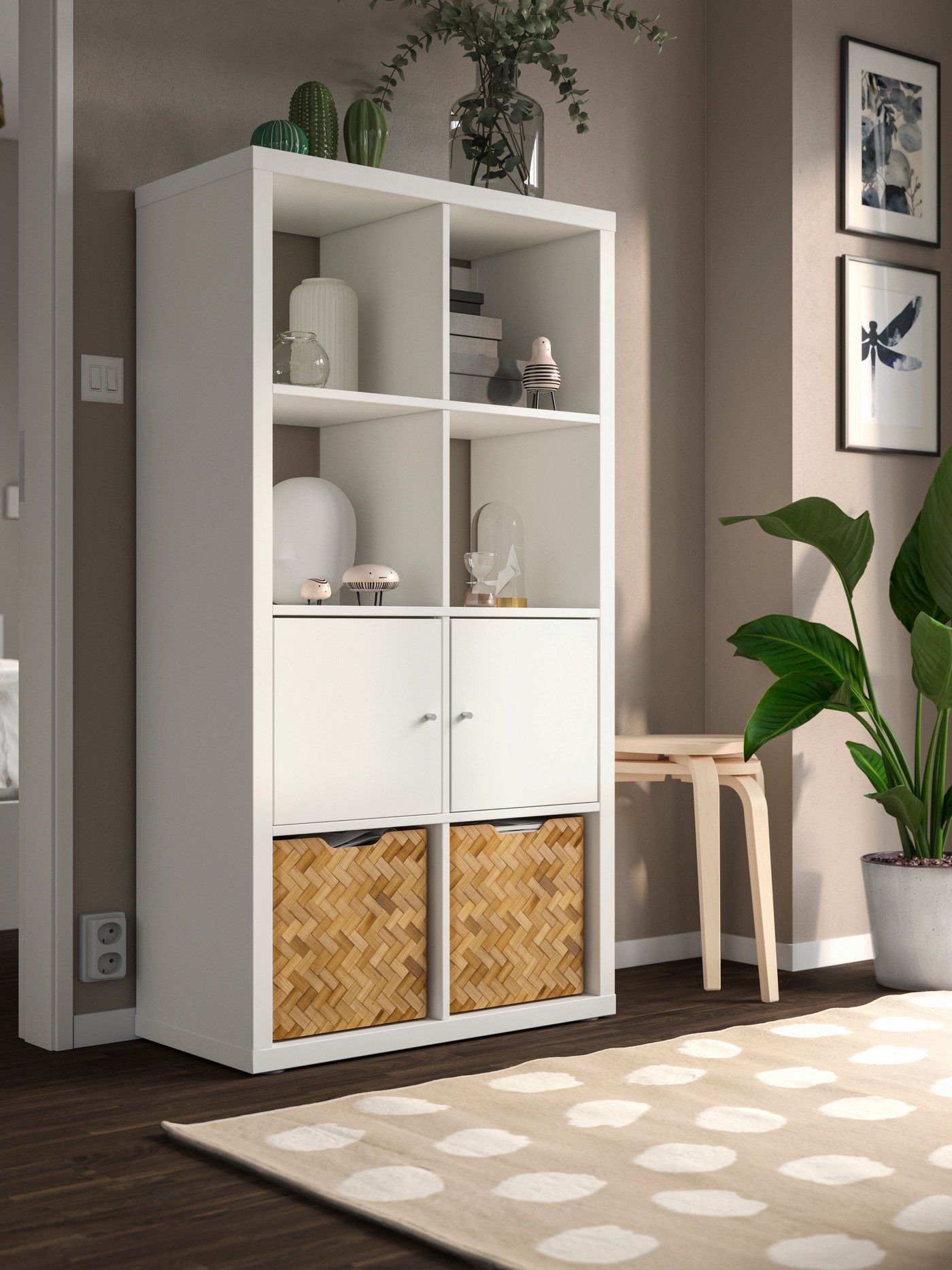A white KALLAX shelving unit with doors in the living room