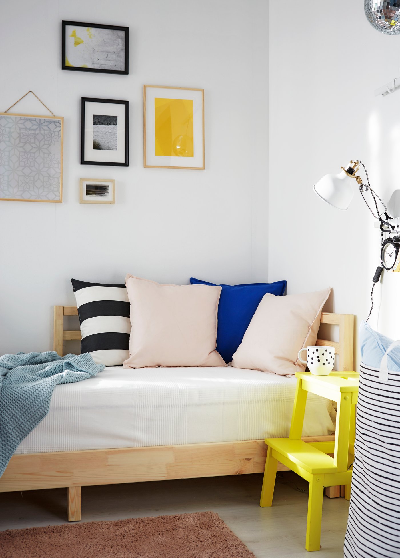 An aspen BEKVÄM step stool in the bedroom next to a TARVA bed frame