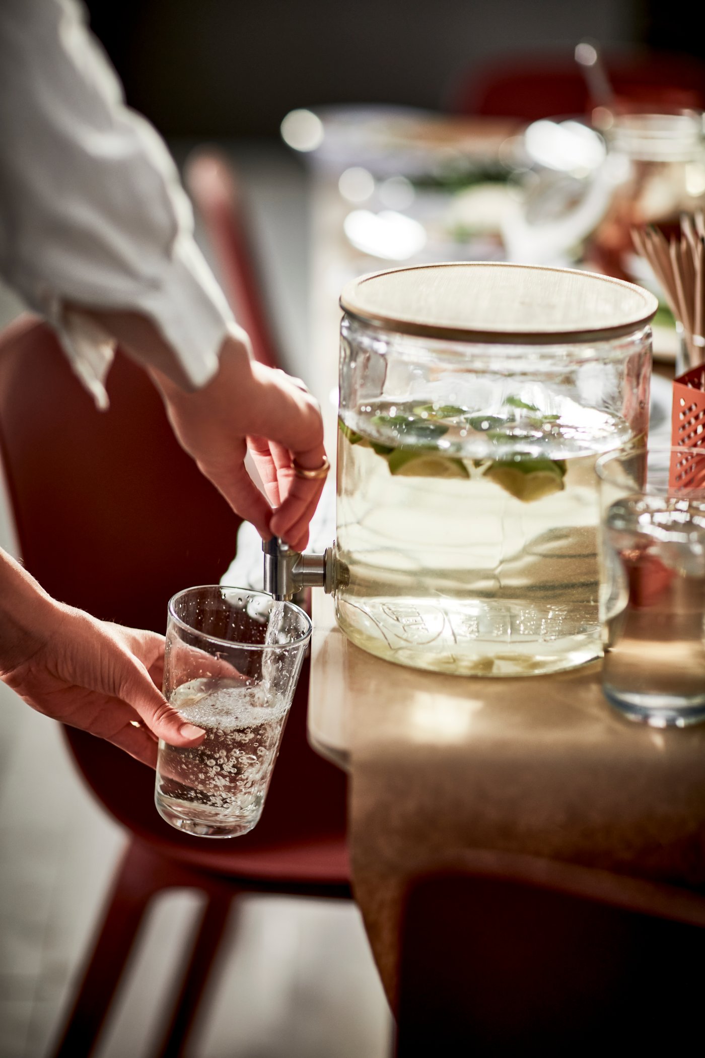 A bamboo/clear glass IKEA 365+ jar with tap in the dining room