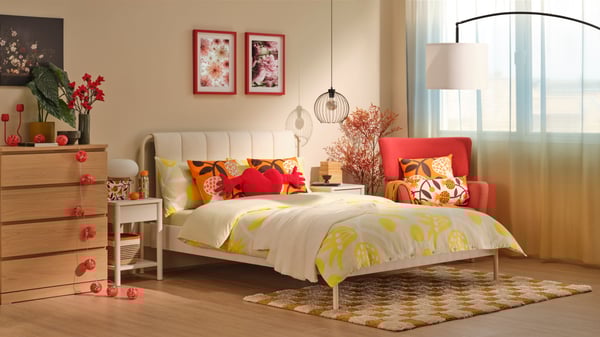 A pomegranate/yellow FÖSSTA duvet cover and pillowcase
