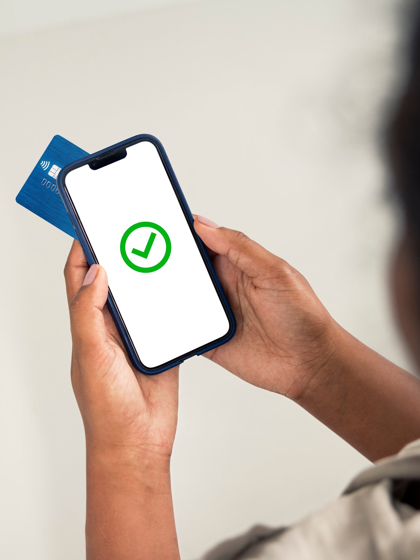 Someone is paying for their purchase with a credit card on a mobile smartphone. 