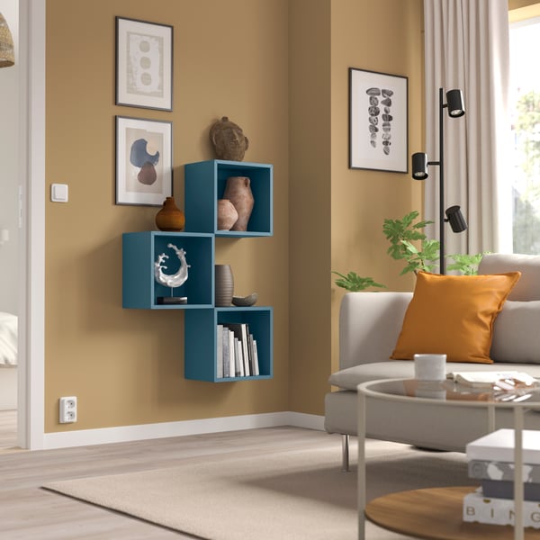 A bright orange GURLI cushion cover in the living room