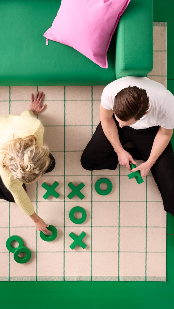 An off-white/green RIDSTIG rug, flatwoven