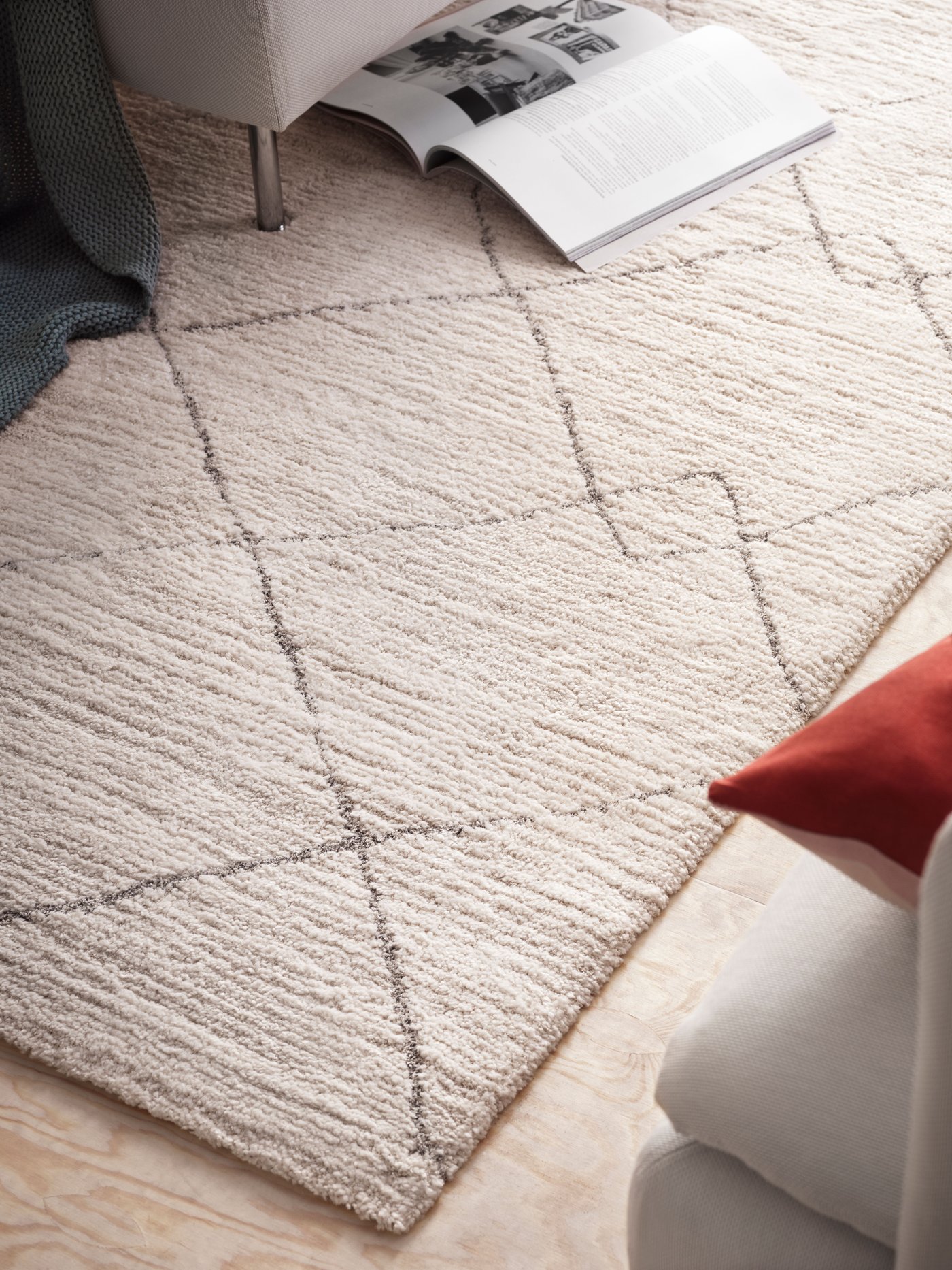 A beige TVERSTED rug, low pile