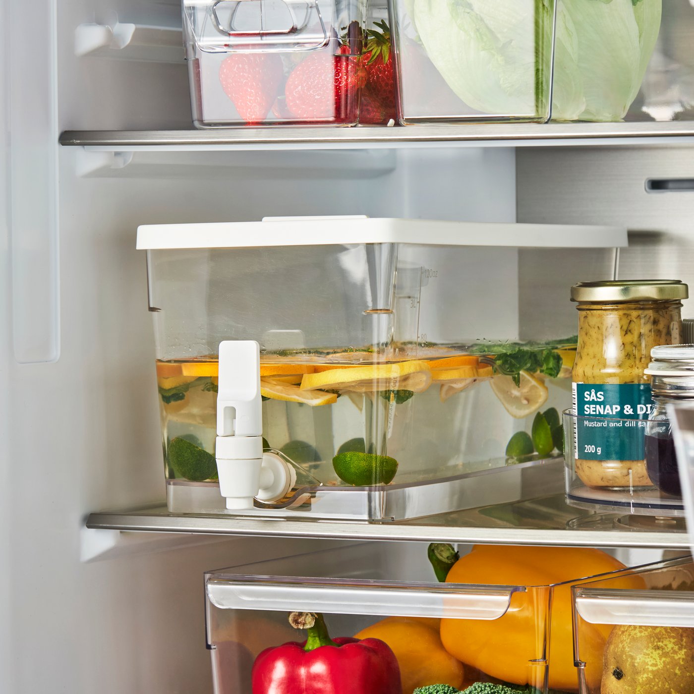 A transparent KLIPPKAKTUS container w tap disp for fridge