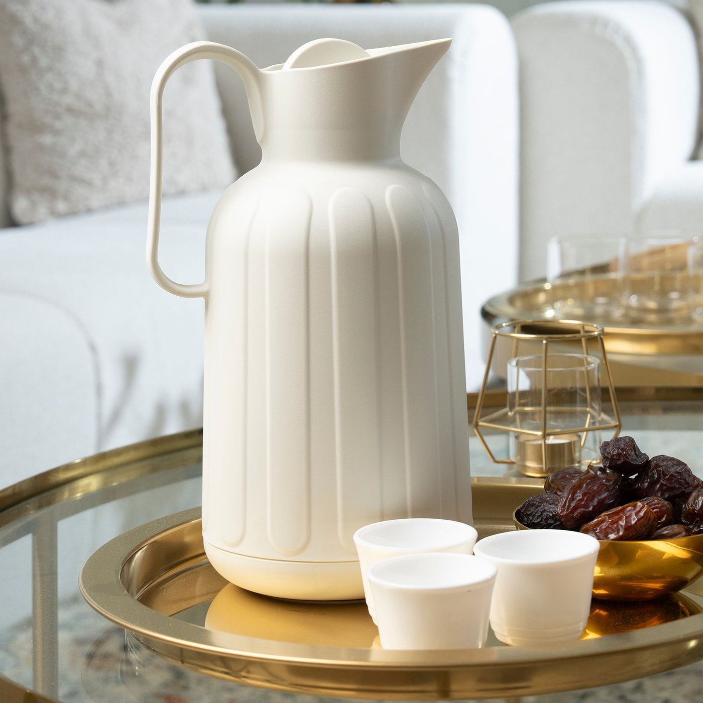 A gold effect/glass TORSJÖ coffee table