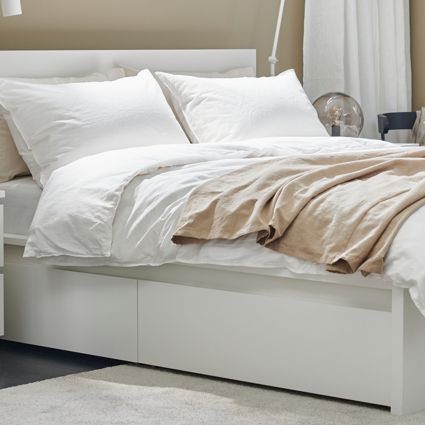A white MALM chest of 2 drawers in the bedroom