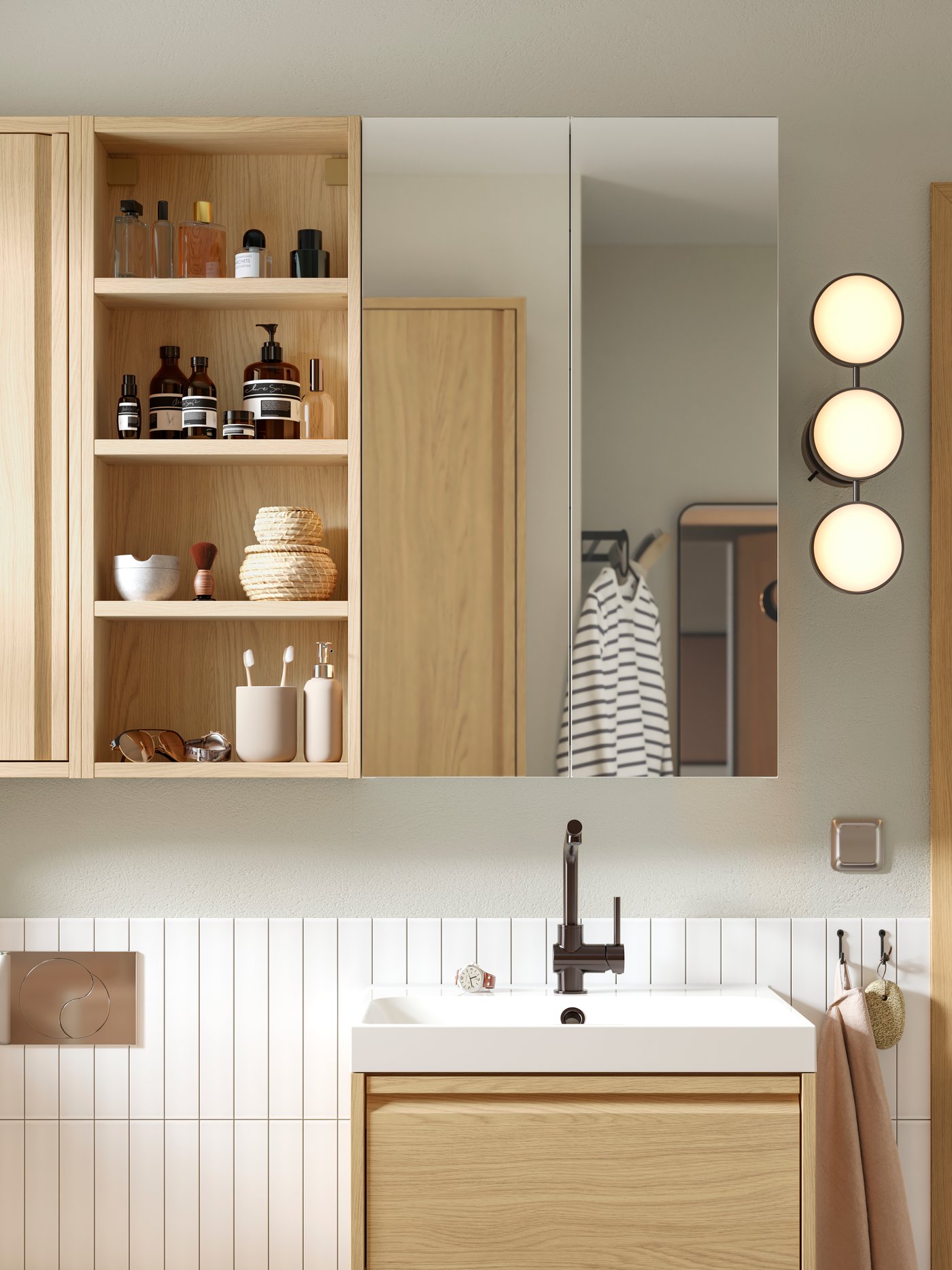 A white BACKSJÖN wash-basin in the bathroom