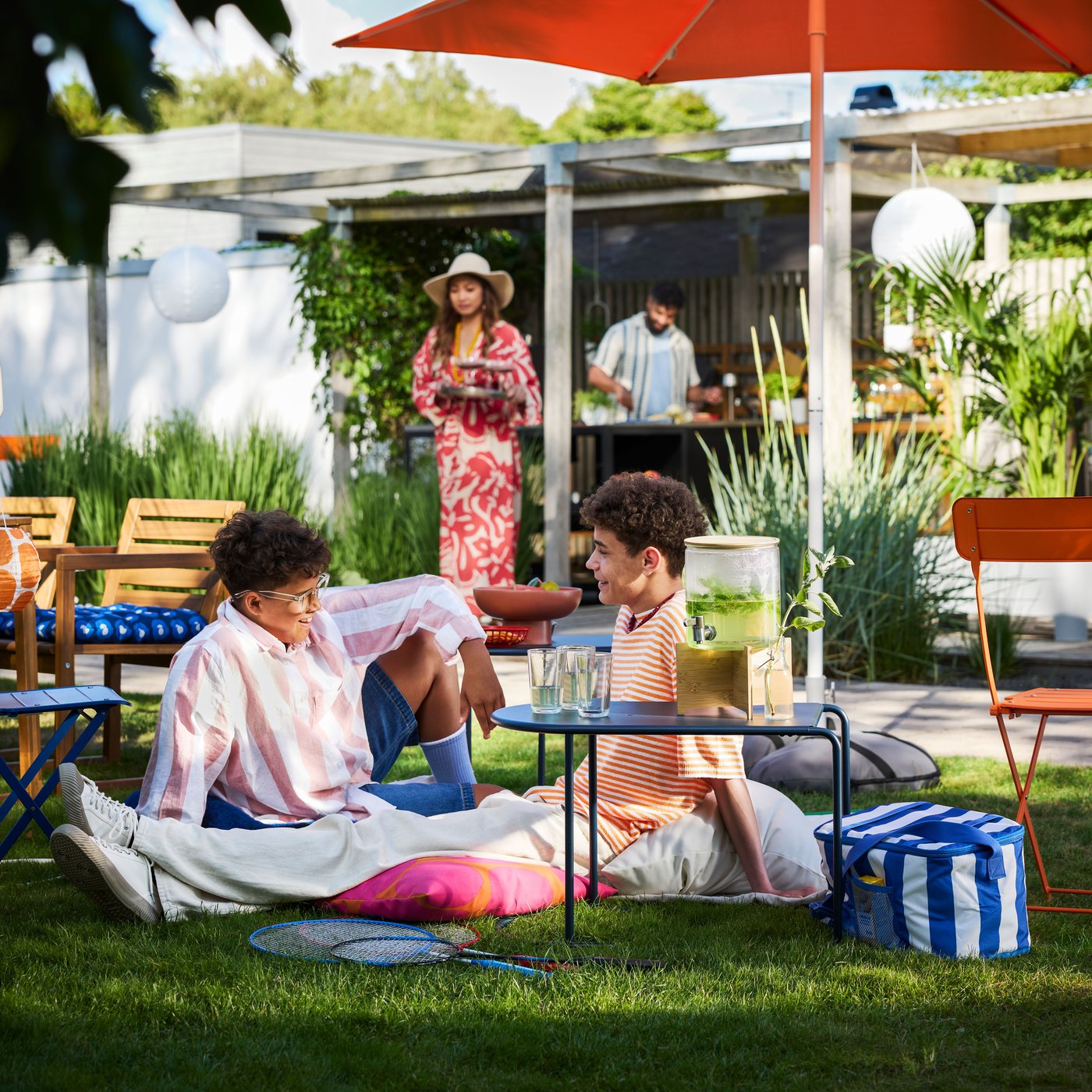 A bamboo/clear glass IKEA 365+ jar with tap outside
