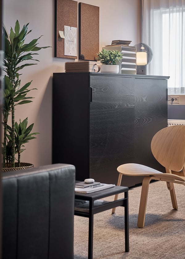 A black stained ash veneer GALANT cabinet with sliding doors