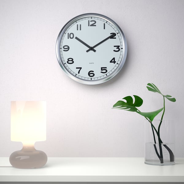 A stainless steel PUGG wall clock
