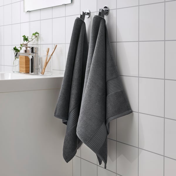 A dark grey FREDRIKSJÖN hand towel