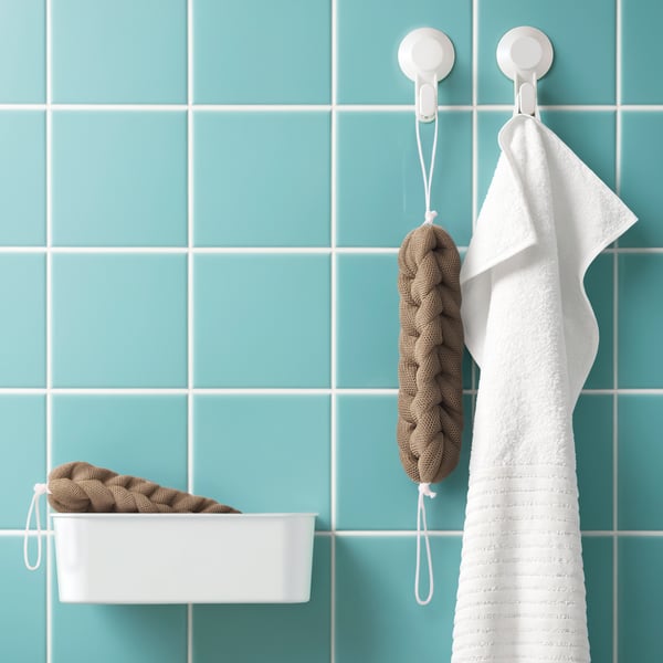 A beige FLADINGEN body puff in the bathroom