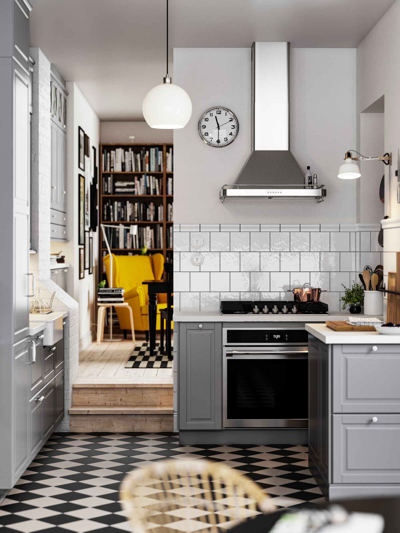 A traditional kitchen with a chequered floor, grey BODBYN kitchen fronts and white/light gray stone effect/laminate countertops.