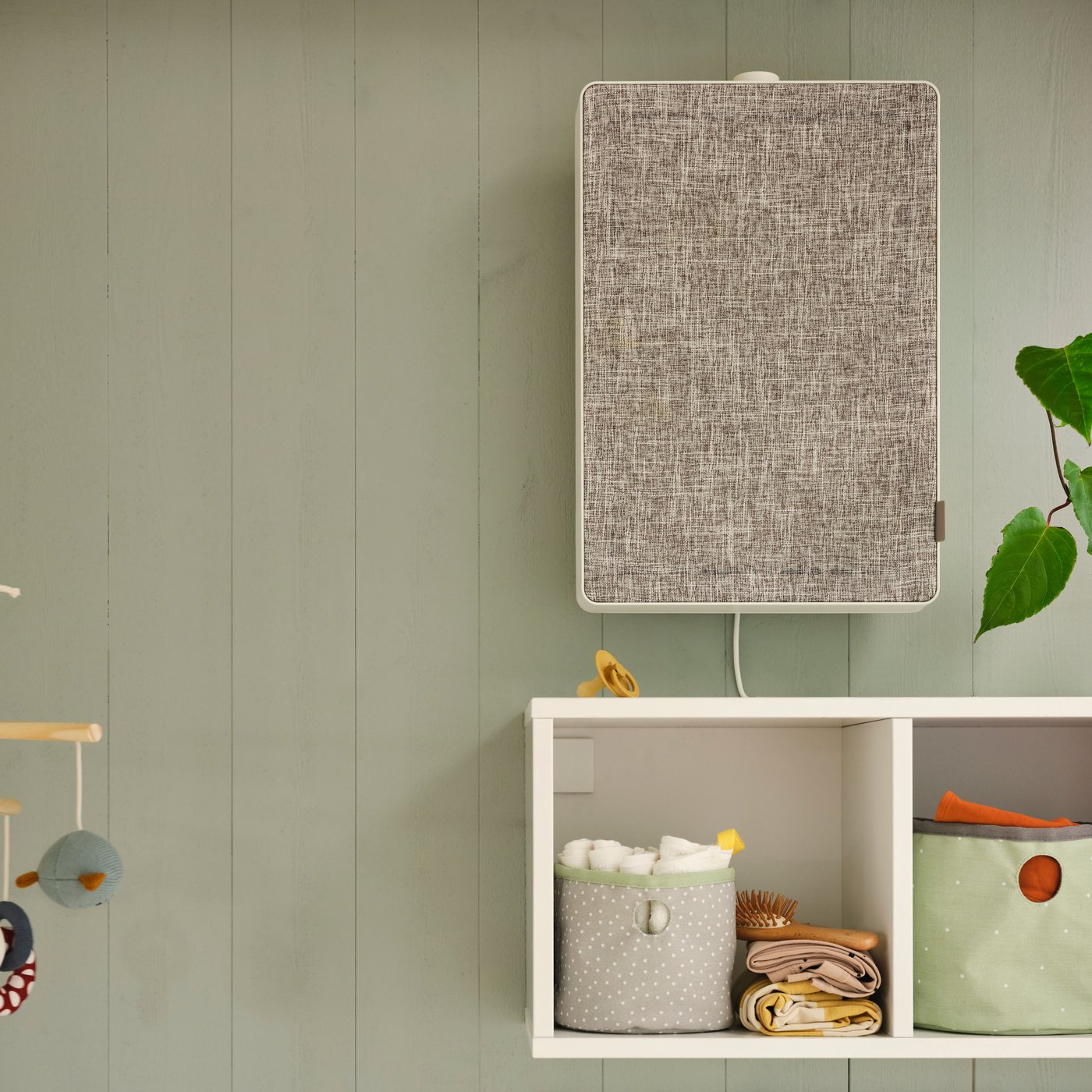 A white FÖRNUFTIG air purifier in the childrens room.