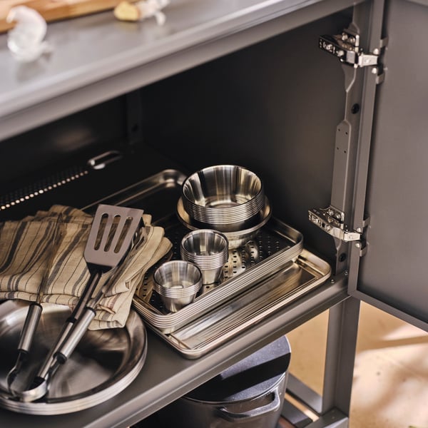 A stainless steel GRILLTIDER bowl for dip sauce