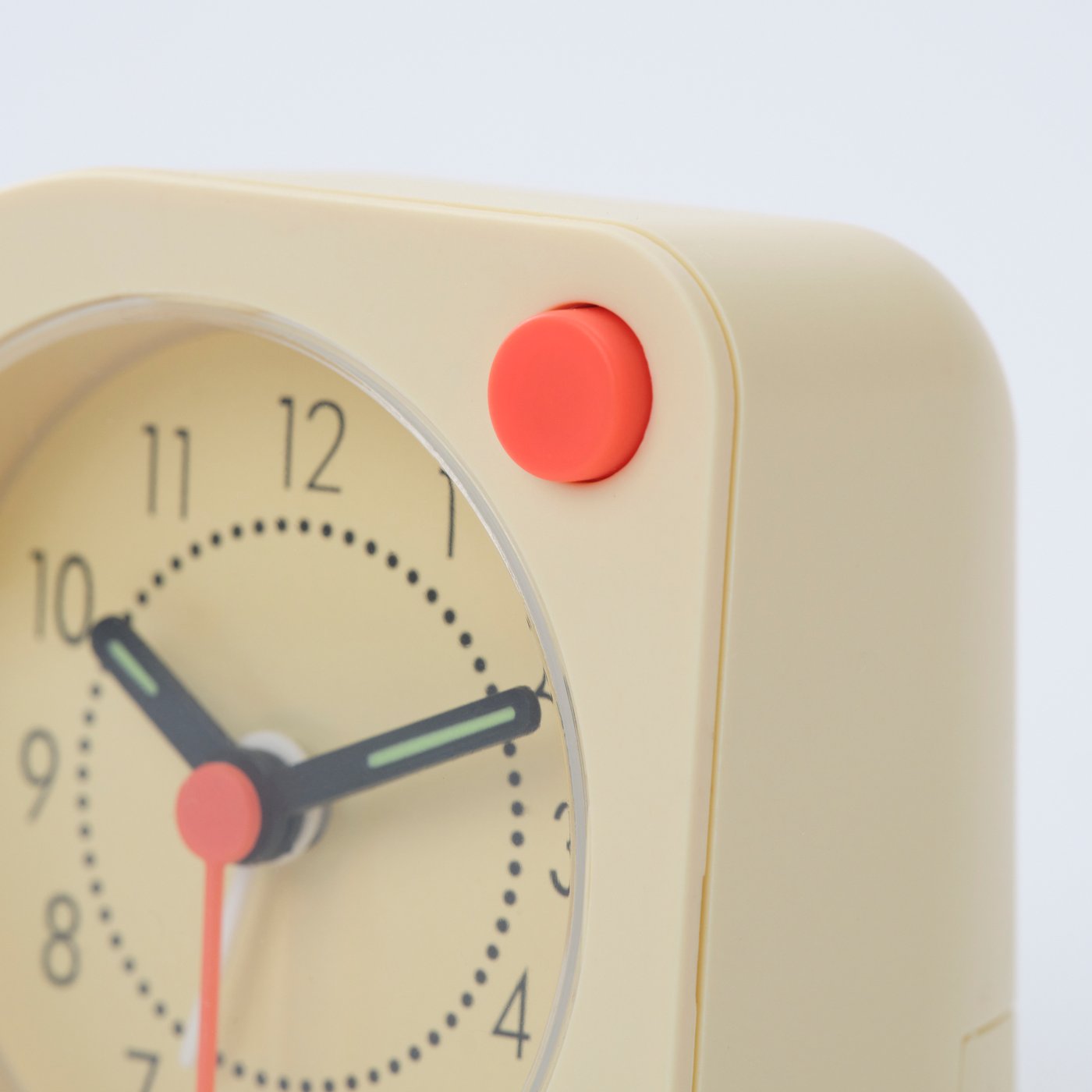 A pale yellow TJINGA alarm clock