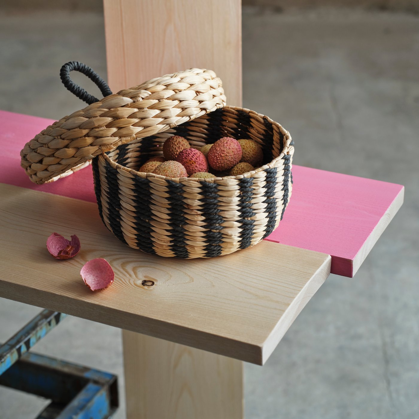 A banana fibre/black stripe pattern MÄVINN box with lid