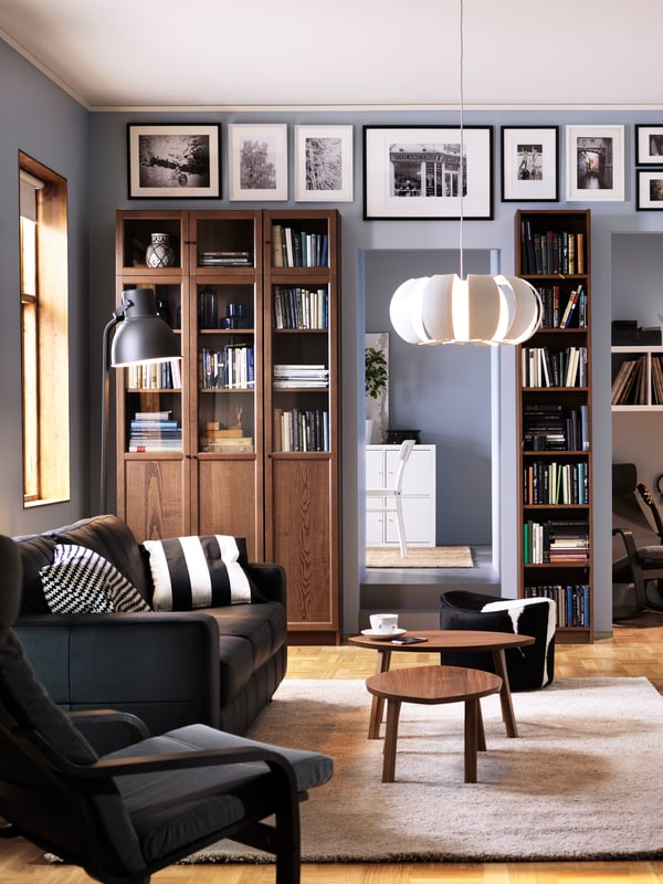 A walnut veneer STOCKHOLM nest of tables in the living room