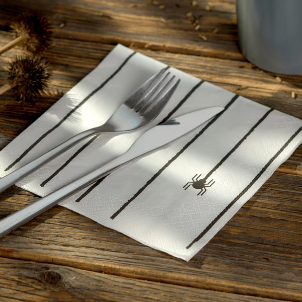 A white/spider black KUSTFYR paper napkin