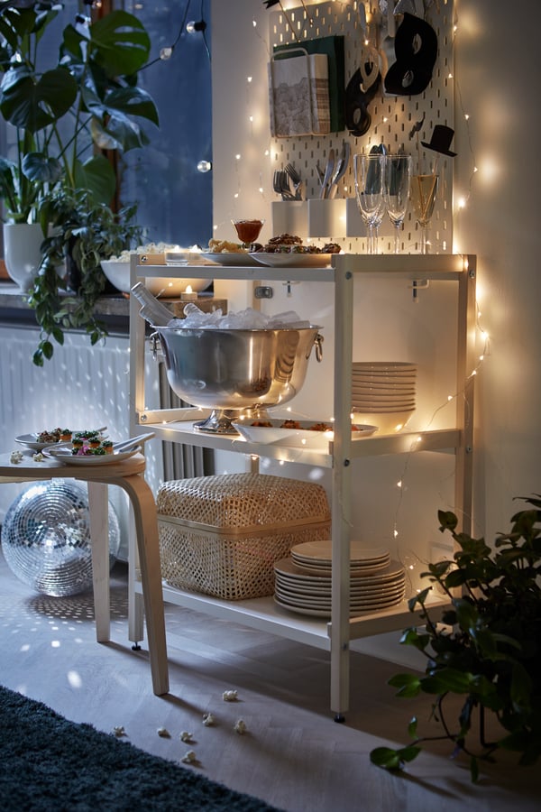 A white SKÅDIS pegboard in the living room