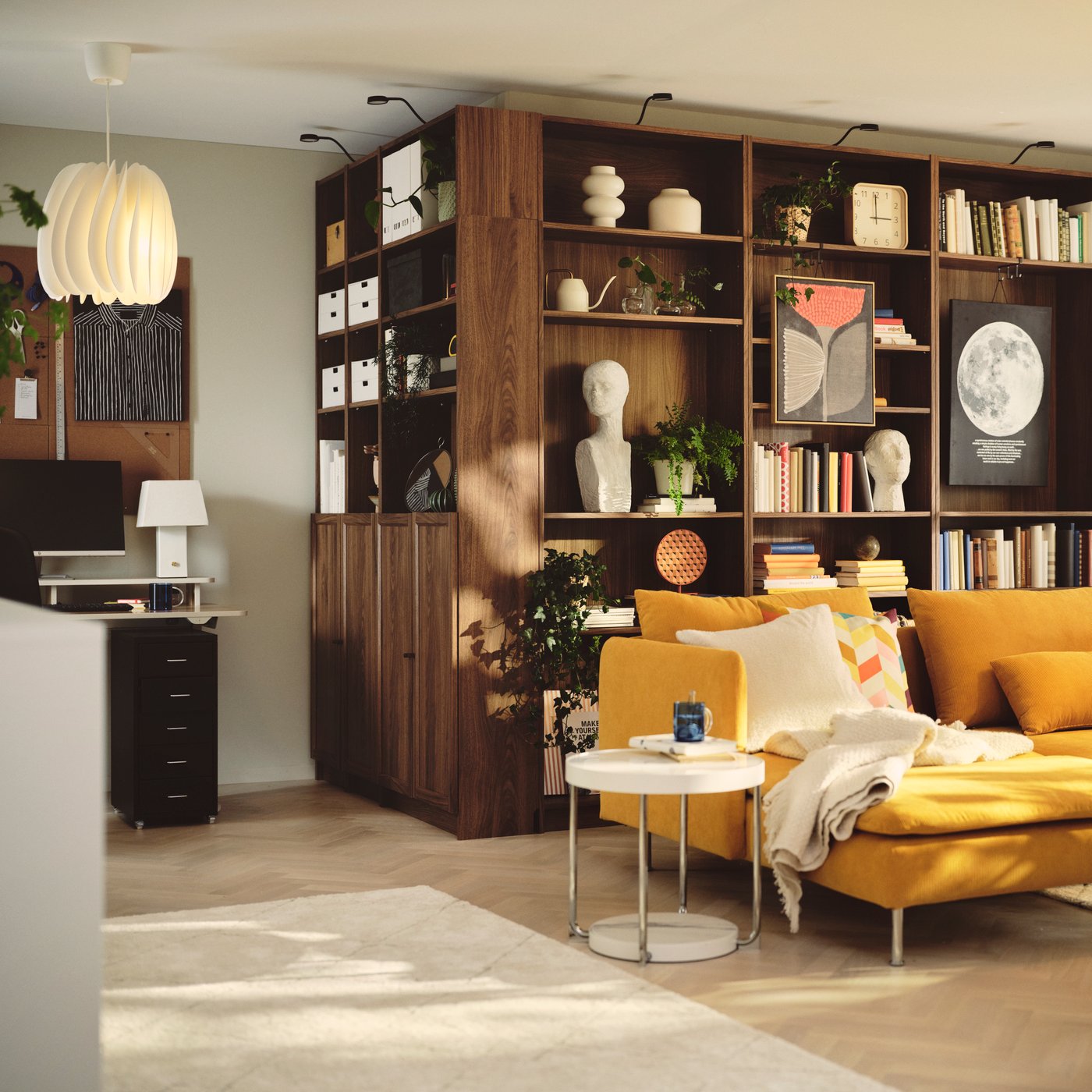 A living room contains a brown BILLY bookcase made from brown walnut effect, filled with books and decorative items.