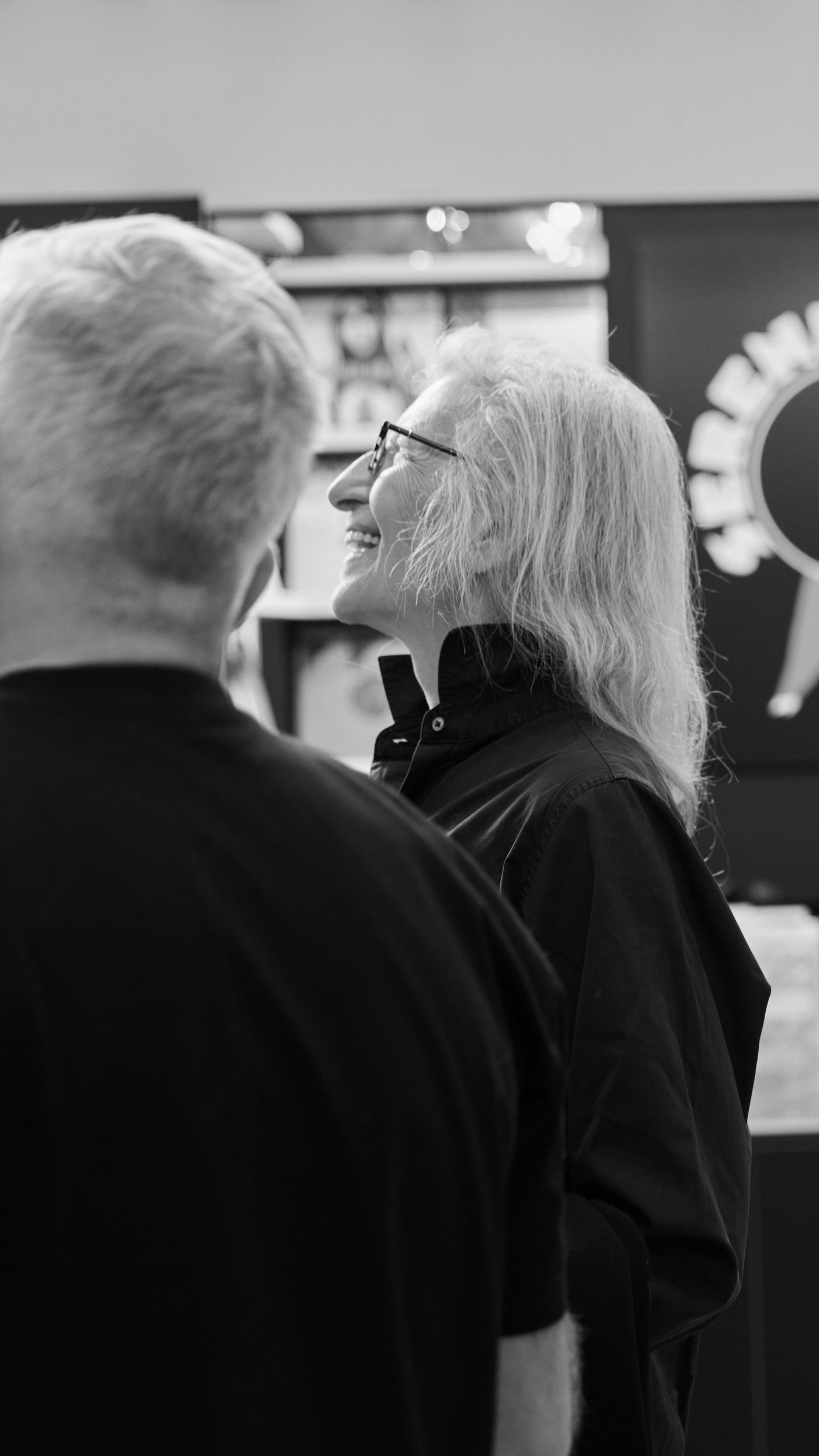 Two people having a discussion and having a laugh together.  