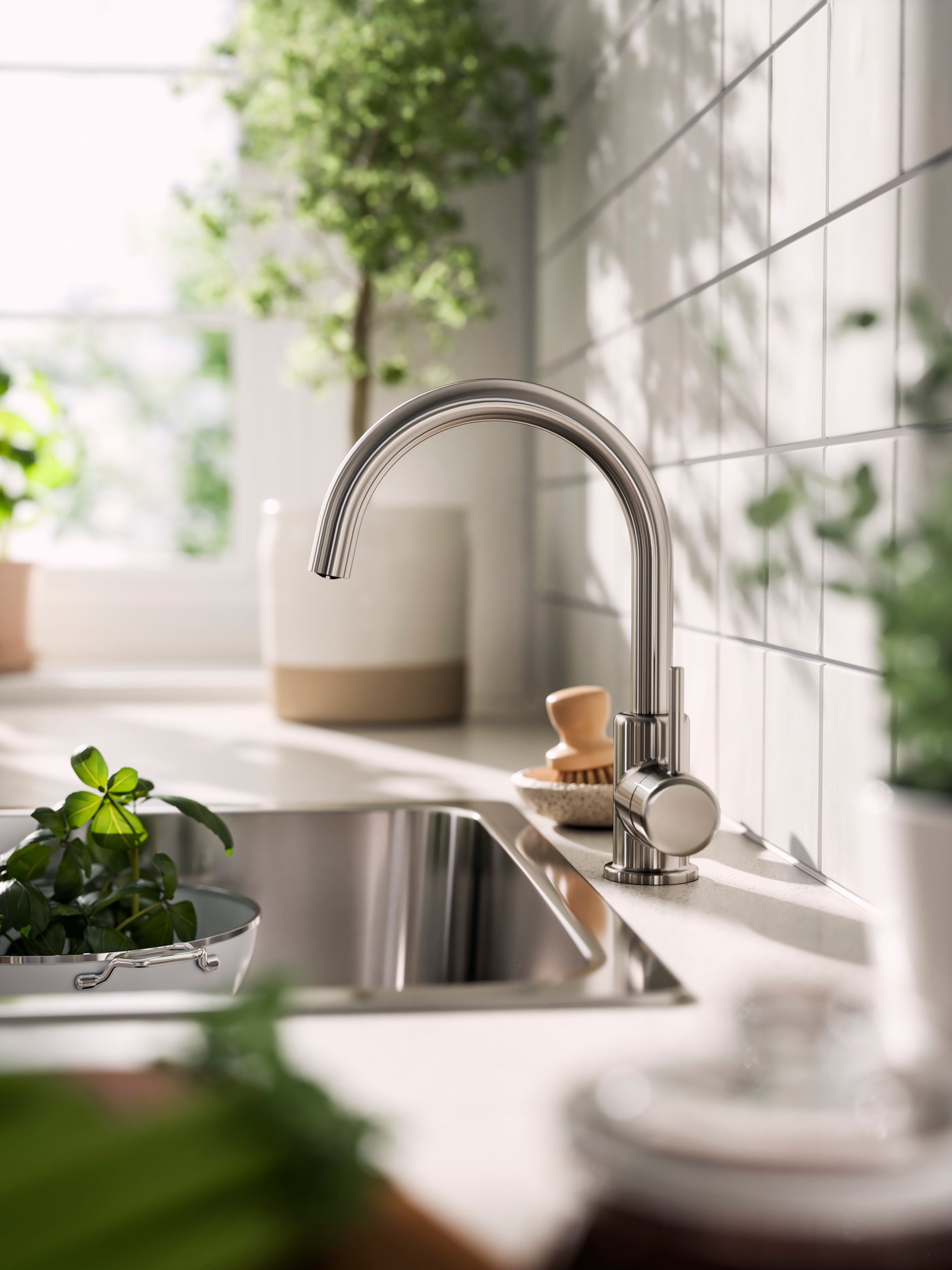 A stainless steel effect GLYPEN mixer tap