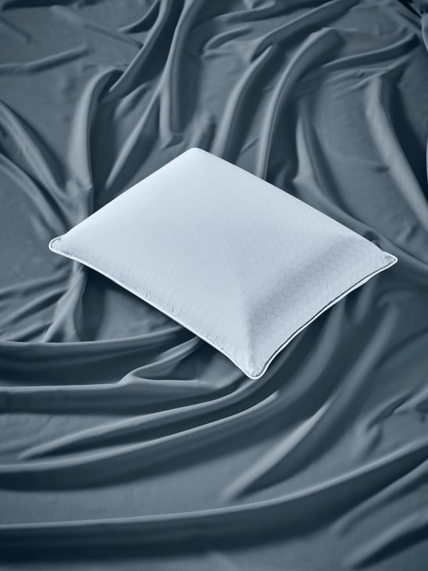 A KVARNVEN ergonomic pillow, side/back sleeper
