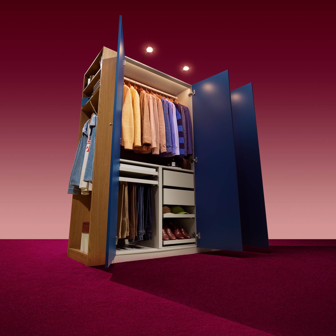 A full PAX wardrobe solution stood in studio lighting, the doors open, showing off the organised interior.