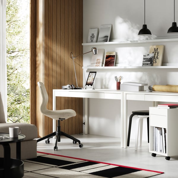 An off-white TONSTAD desk