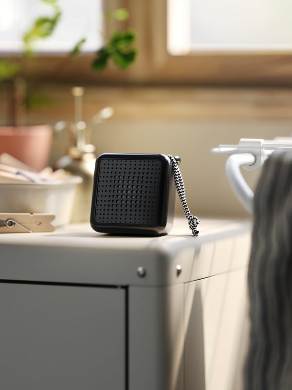 A waterproof/black VAPPEBY portable bluetooth speaker