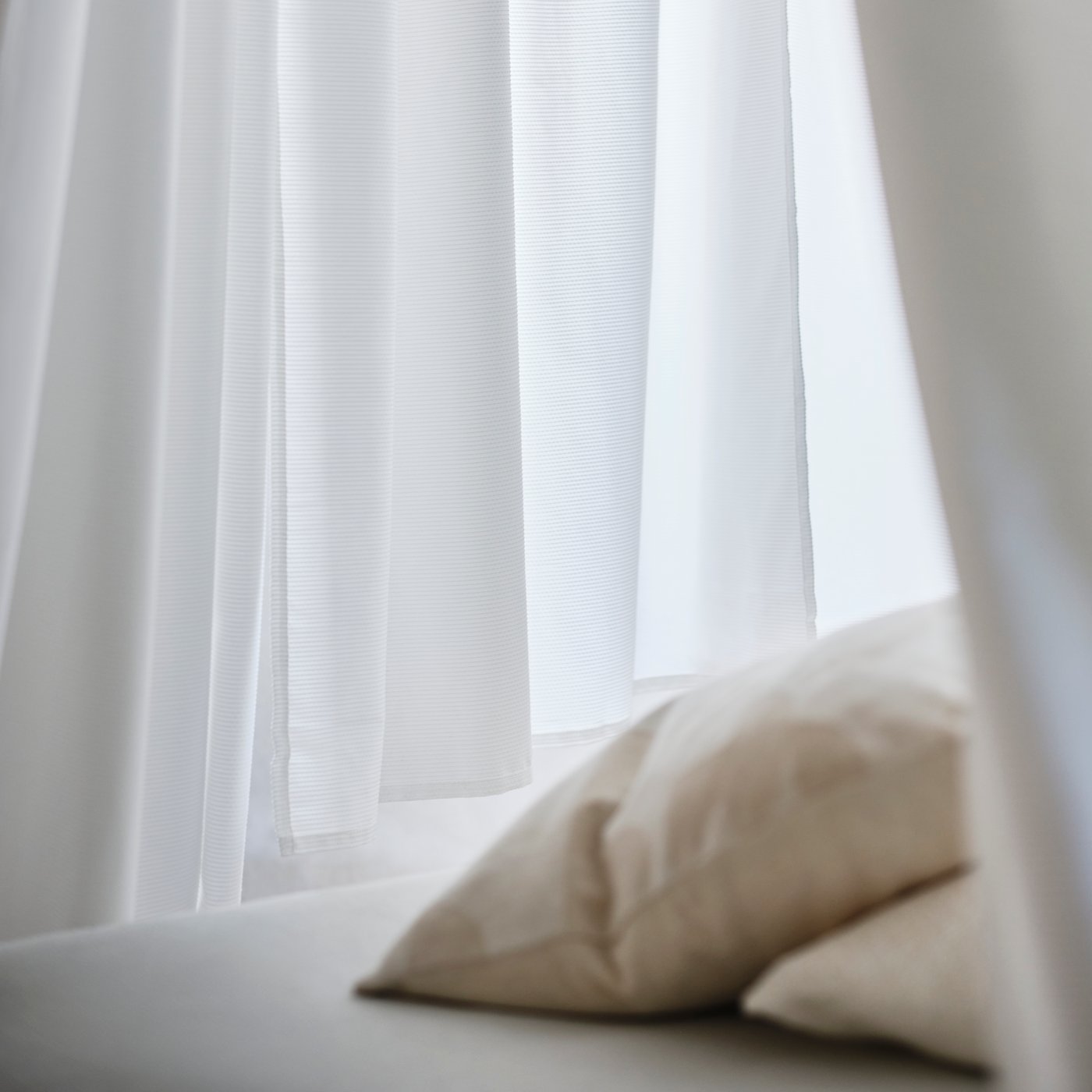 A beige RÖDASK cushion cover