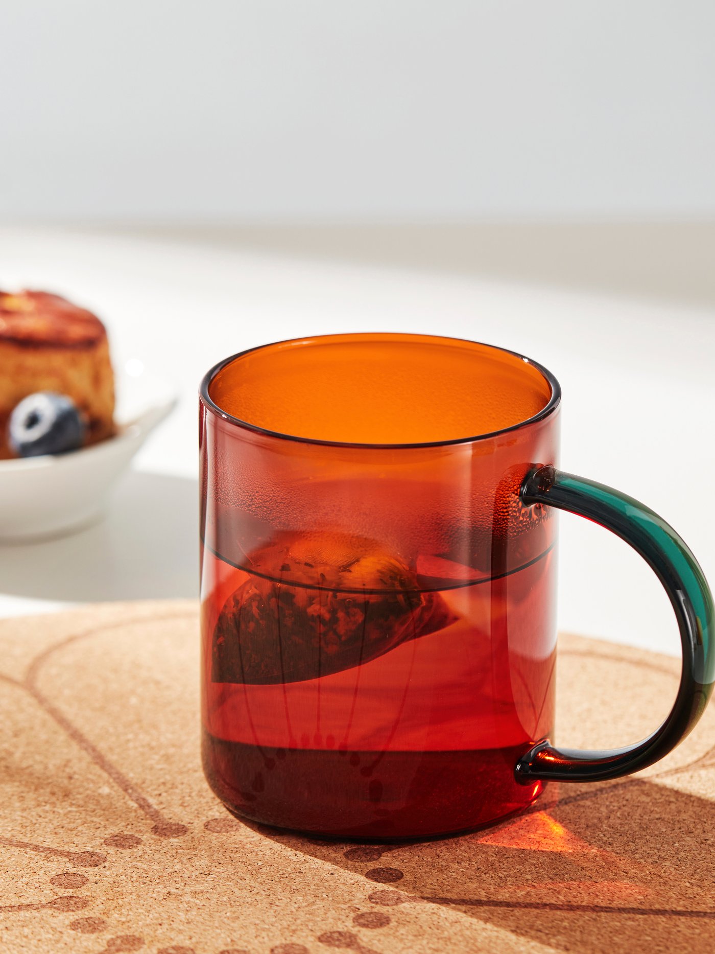 A multicolour brown/green SKUGGSTUBB mug