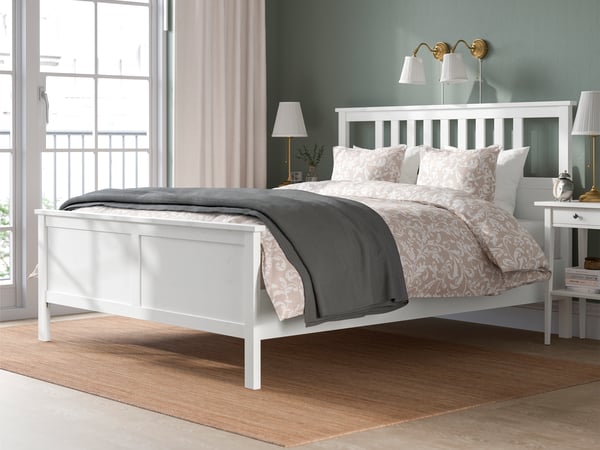 A white stain HEMNES bed frame.