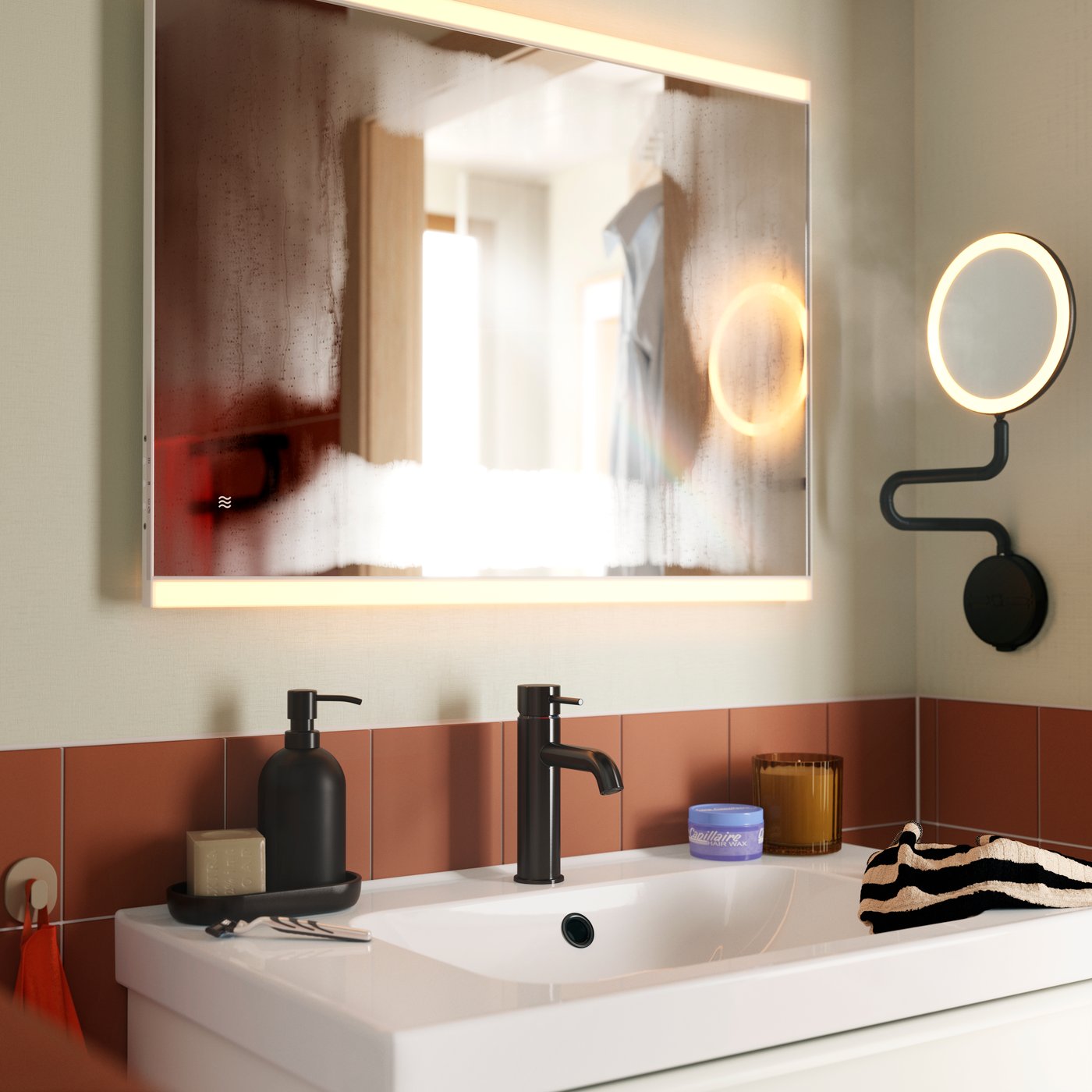 A KÄRRSJÖN mirror with integrated lighting mounted above a round washbasin and black tap, in a terracotta-tiled bathroom.