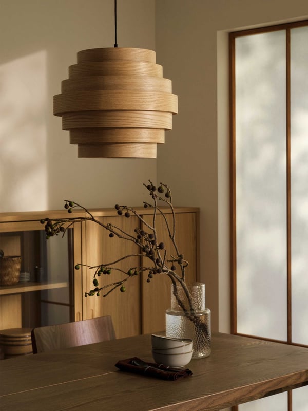 An oak veneer TONSTAD cabinet with sliding doors