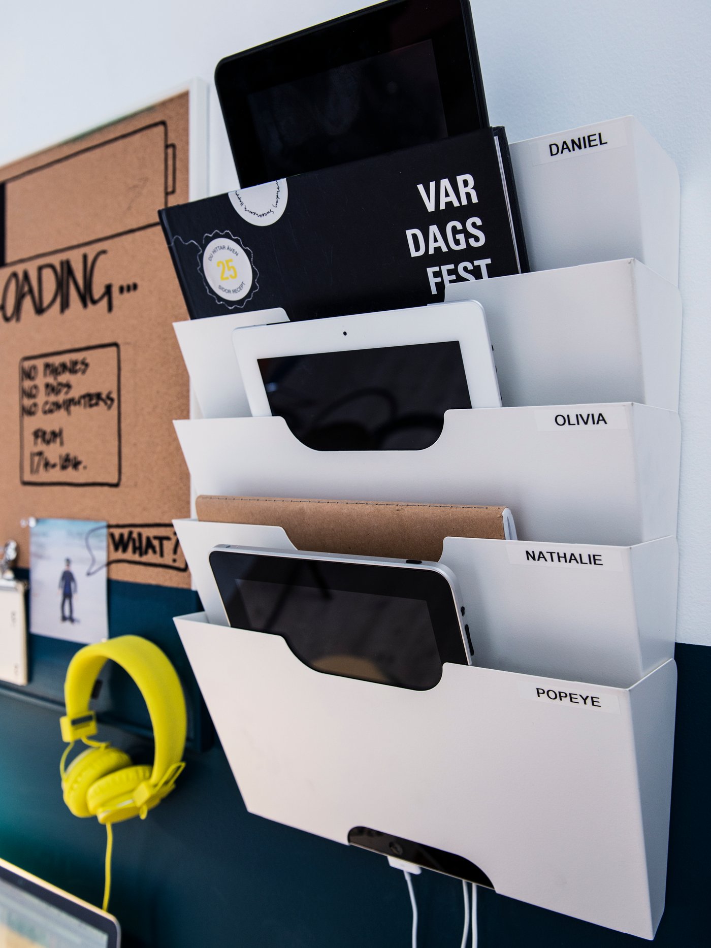 A white KVISSLE wall newspaper rack in the home office