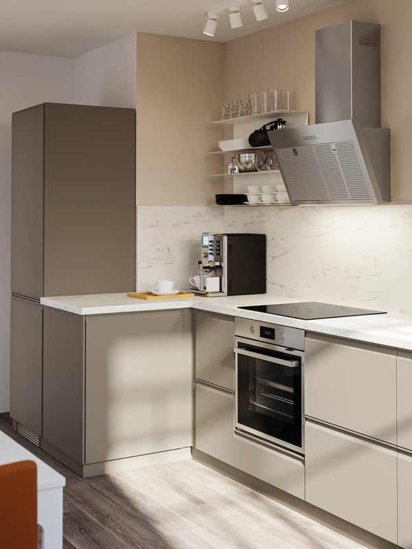 UPPLÖV drawer fronts in matte dark beige,and EKBACKEN worktops in white marble effect laminate.