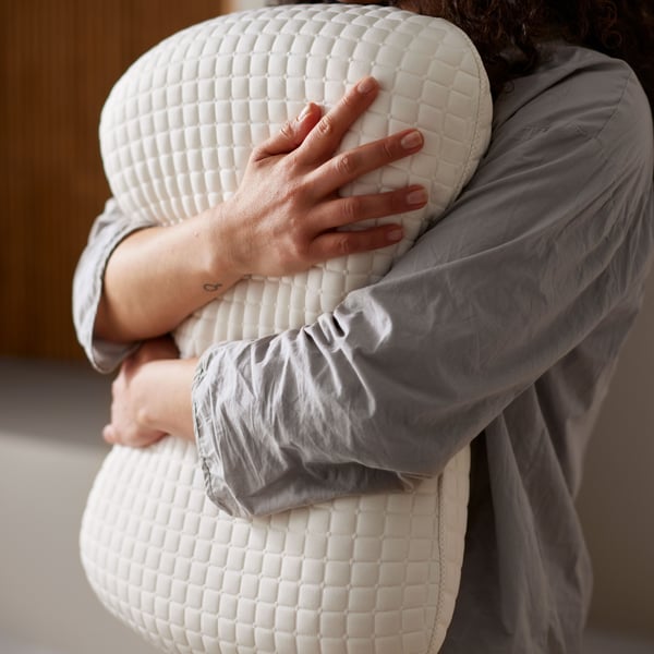 A KLUBBSPORRE ergonomic pillow, side/back sleeper in the living room