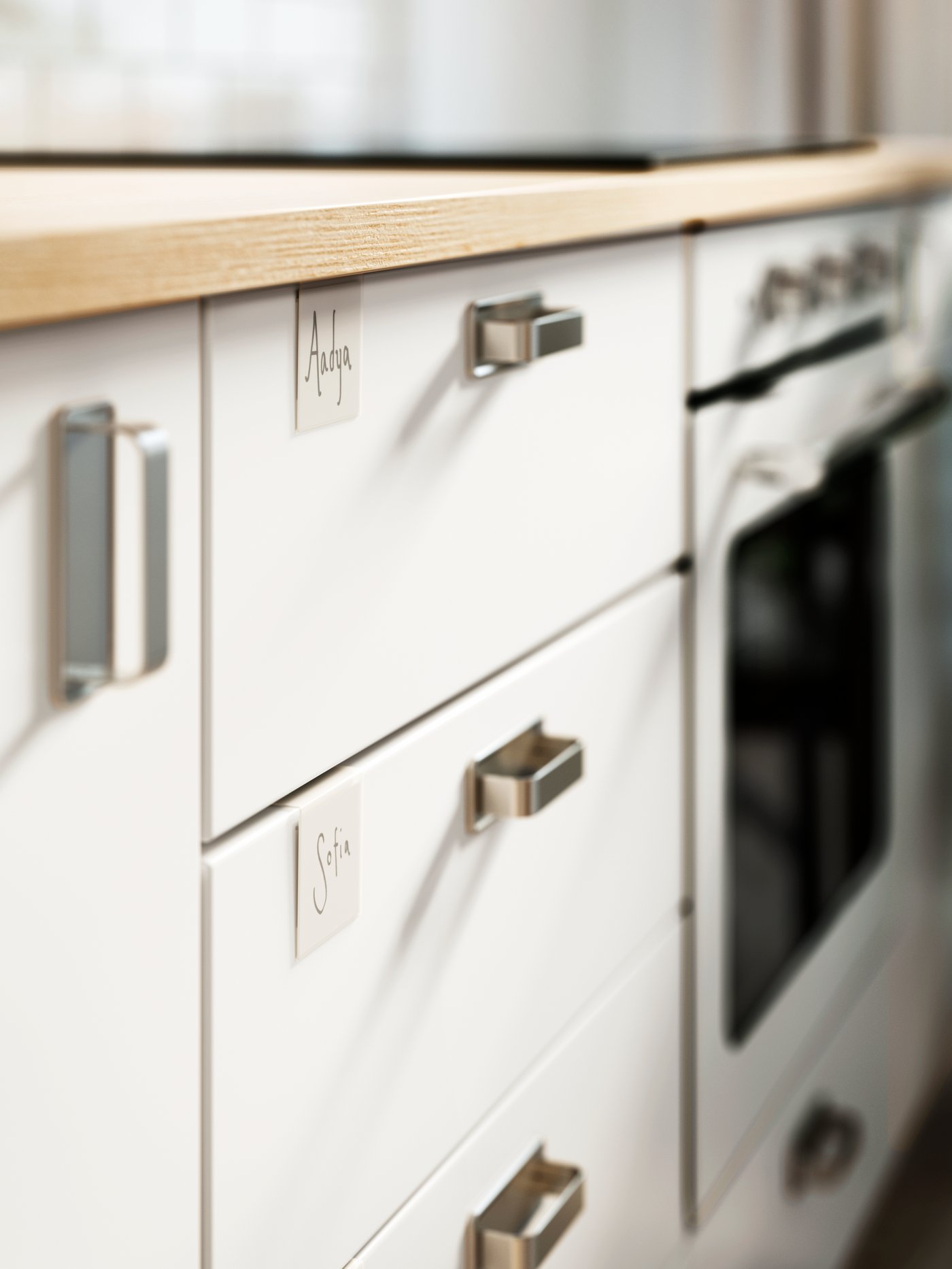A section of an EKBACKEN ash-effect laminate benchtop and a combination of white METOD base cabinets beneath.
