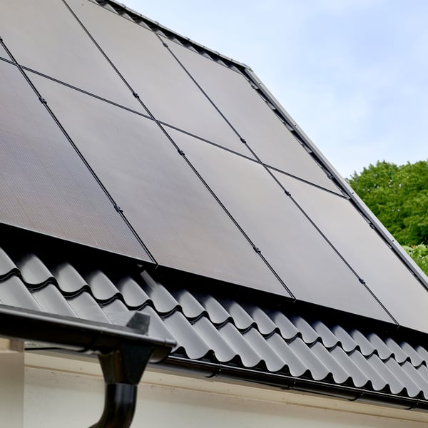 Solar panels on a tilted roof.