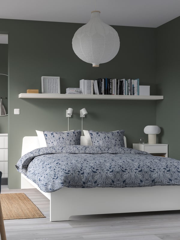 A white ASKVOLL bed frame