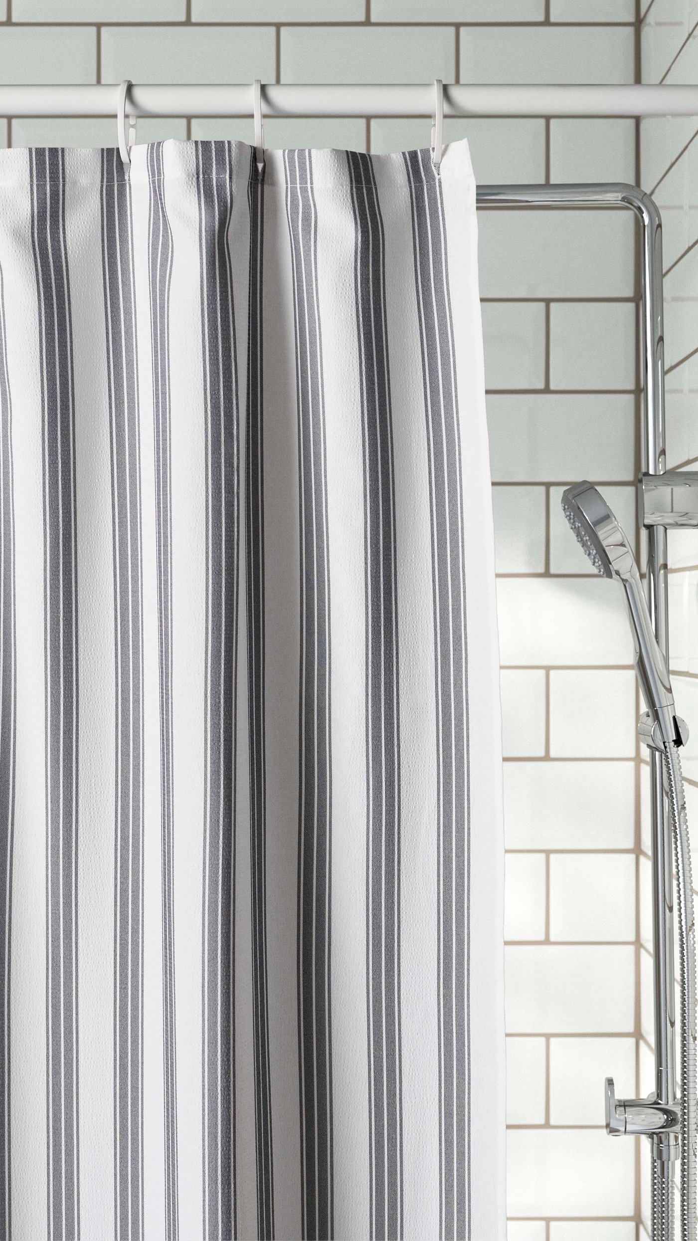 A white BOTAREN shower curtain rod