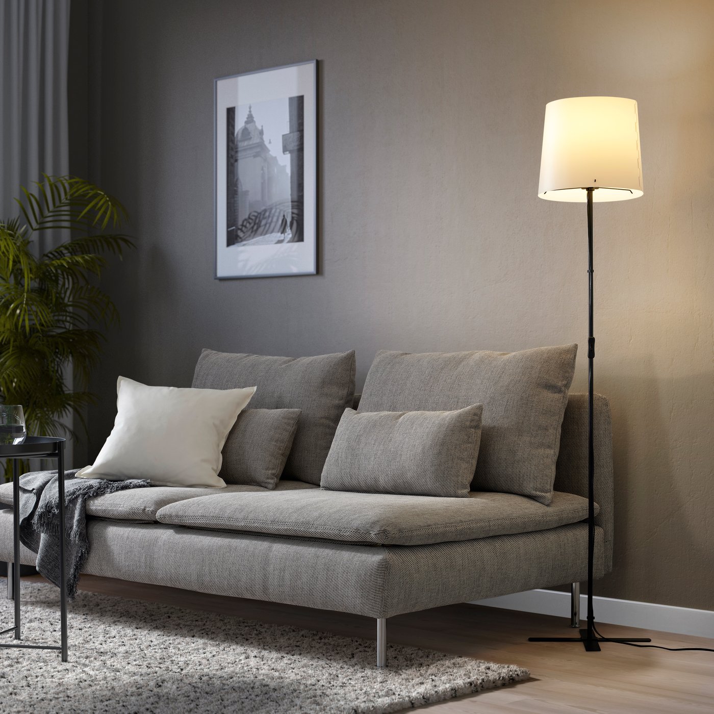 A black/white BARLAST floor lamp