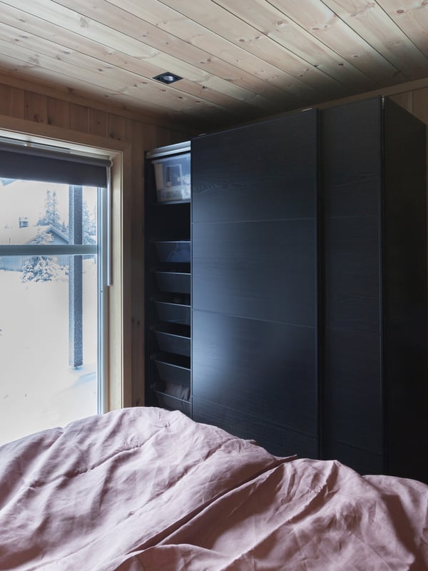 A dark grey KOMPLEMENT mesh basket with pull-out rail