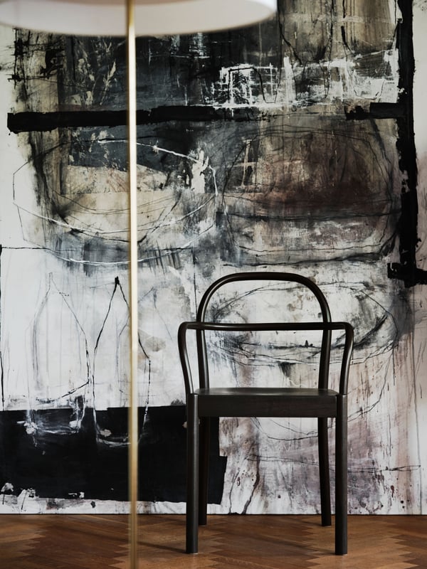 A dark brown STOCKHOLM 2025 chair