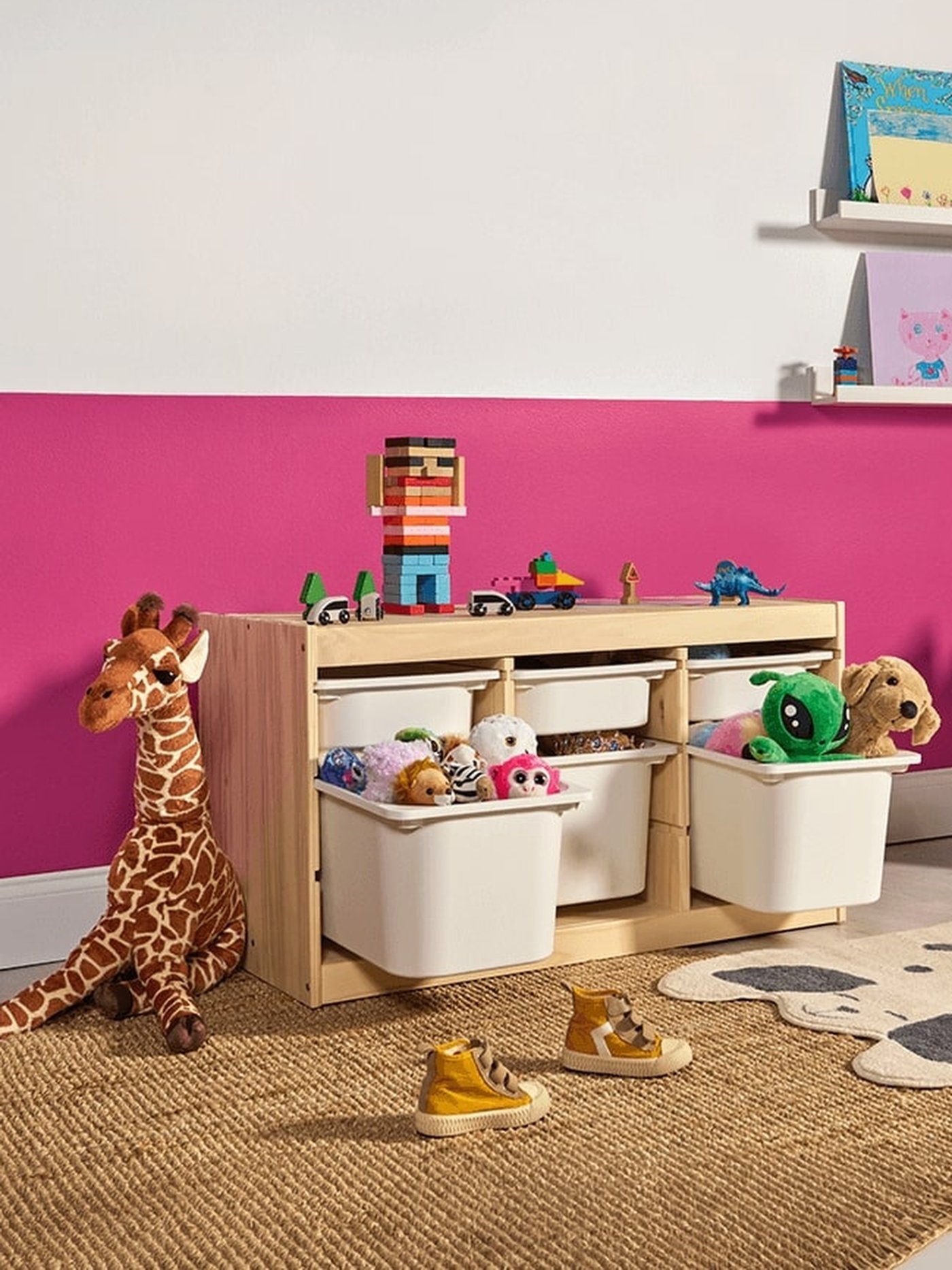 A light white stained pine/white TROFAST storage combination with boxes in the childrens room