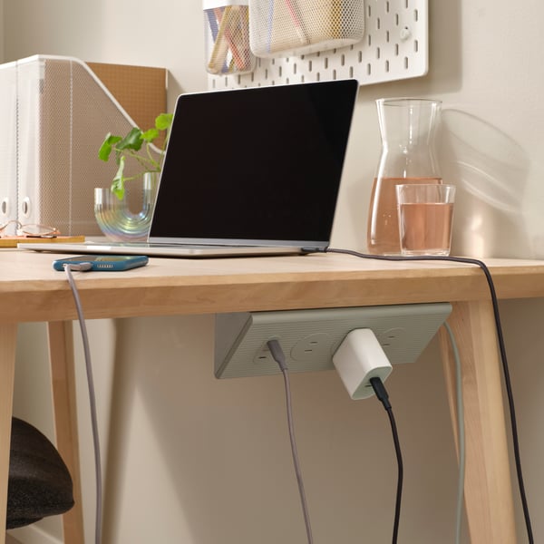 A green SKOTAT extension cord