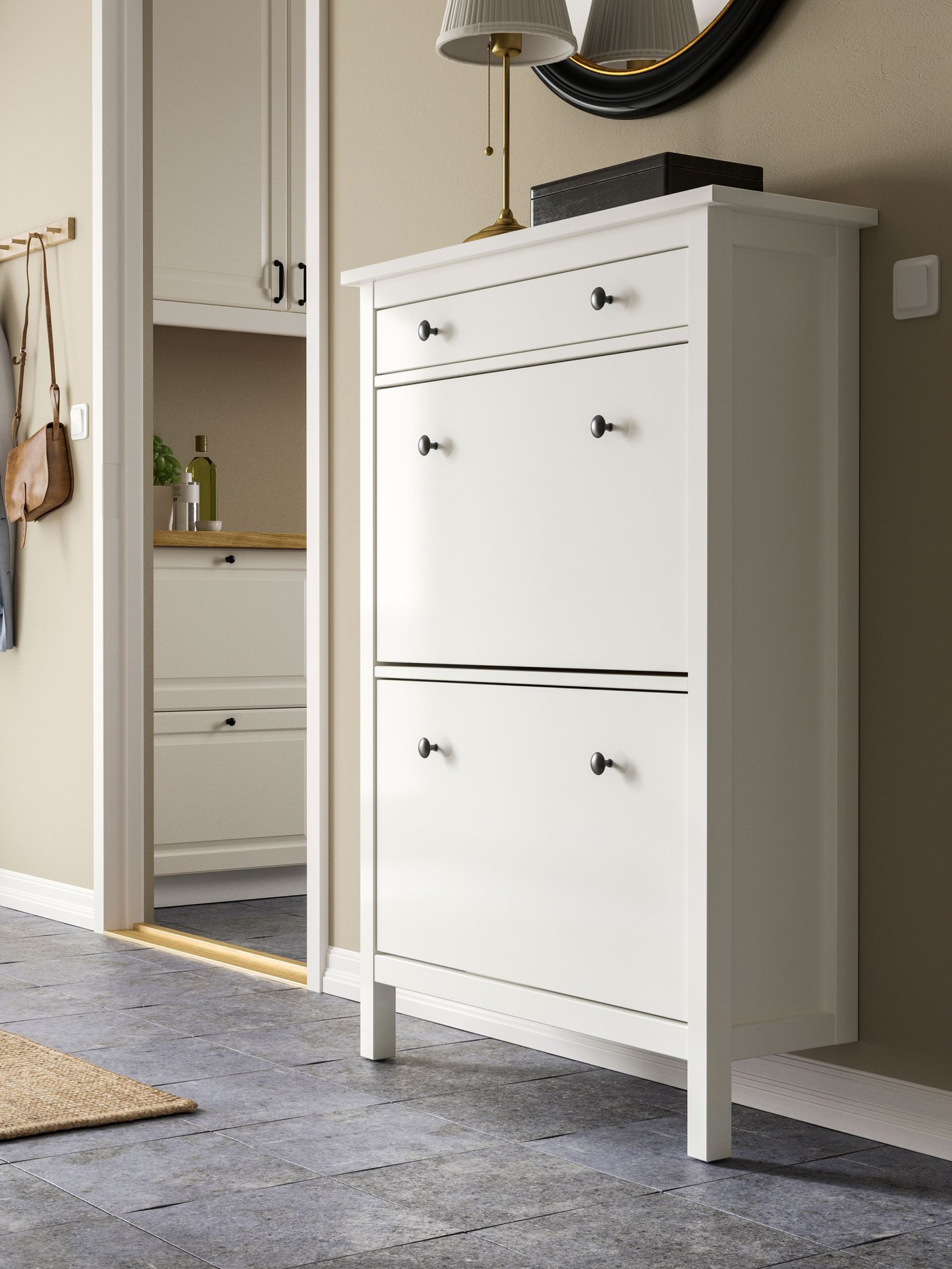 A white HEMNES shoe cabinet with 2 compartments